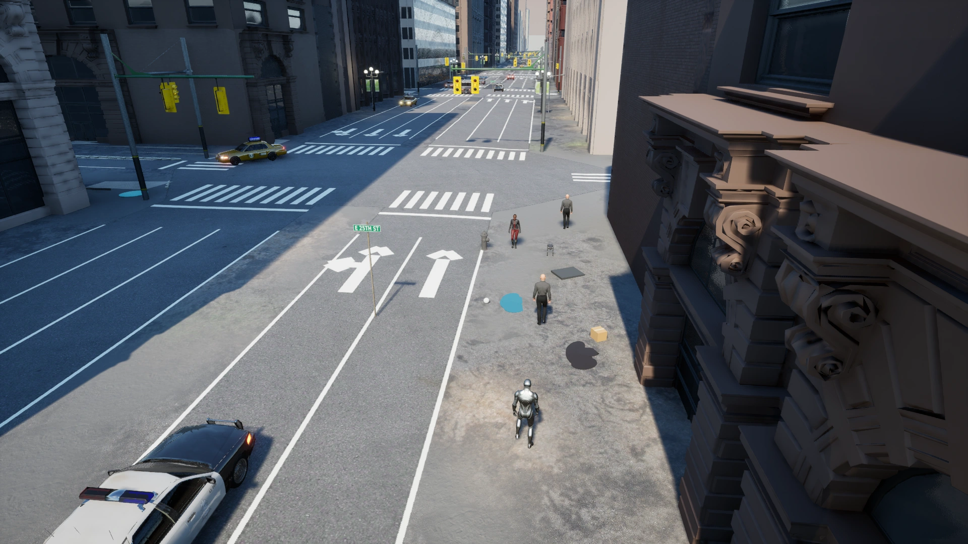 Native NYC scene: an agent starts on the sidewalk beside oil, water, a trip hazard, pedestrians, a robot dog and boxes. The route leads across the marked crossing to the goal, with traffic and signals at the intersection.